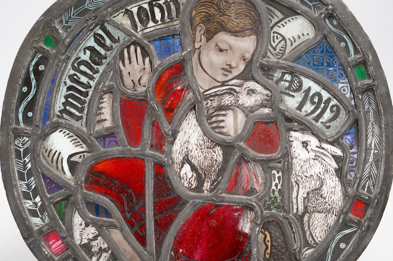 Mabel Esplin (1874–1921), a stained glass roundel with related brochure and letter from artist dated 1912, 33cm. Condition - fair to good